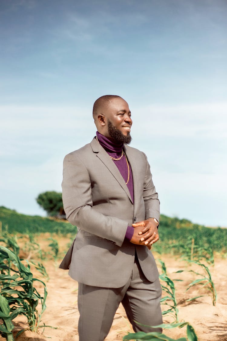 Elegant Man In A Suit Standing Outside 