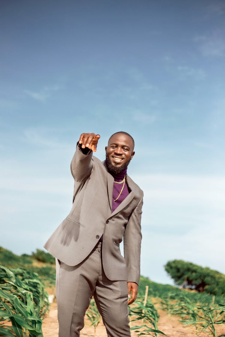 Elegant Man In A Suit Standing Outside 