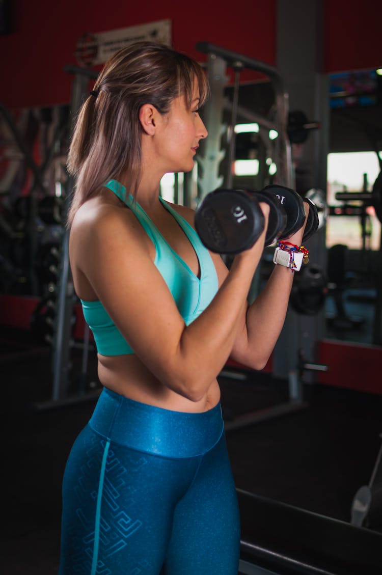 Woman Holding Black Dumbbells