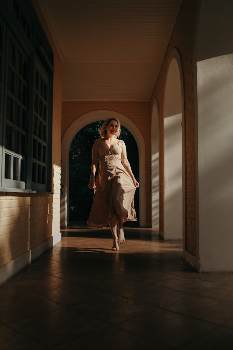 Woman Running On Corridor