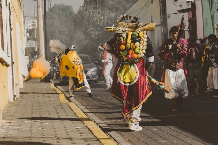 People In Traditional Clothing On Street