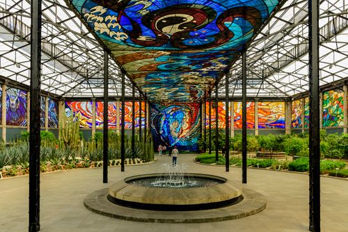 Free Stunning stained glass and garden at Cosmovitral, Toluca's landmark, featuring vibrant colors and lush greenery. Stock Photo