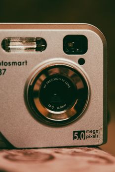 A close-up shot of a vintage camera lens and flash with a classic design, perfect for nostalgia themes.