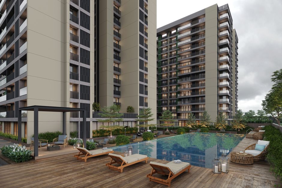 A resort-style pool area at a modern apartment complex with lush landscaping and lounge chairs - arts district apartments A resort-style pool area at a modern apartment complex with lush landscaping and lounge chairs - arts district apartments