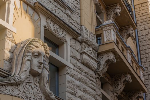 Close-up of an ornate Art Nouveau facade in Riga, featuring intricate carvings and sculptural decorations.. pexels, close, or