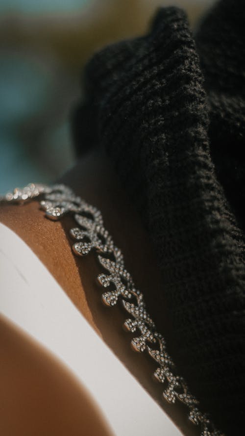 Close-up of a Silver Chain on a Mans Neck 