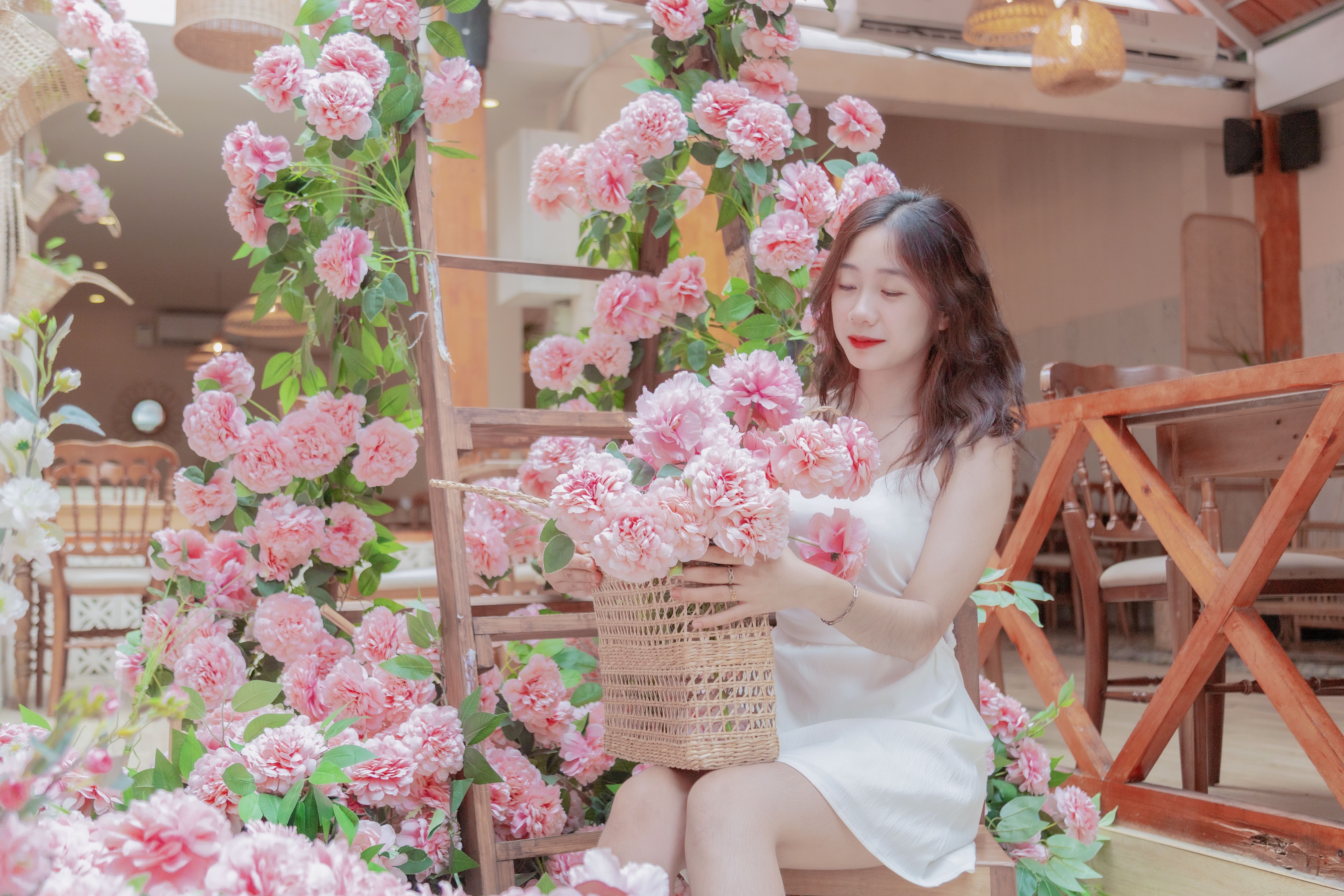 Woman in Pink Dress Sitting and Posing with Pink Flowers · Free Stock Photo