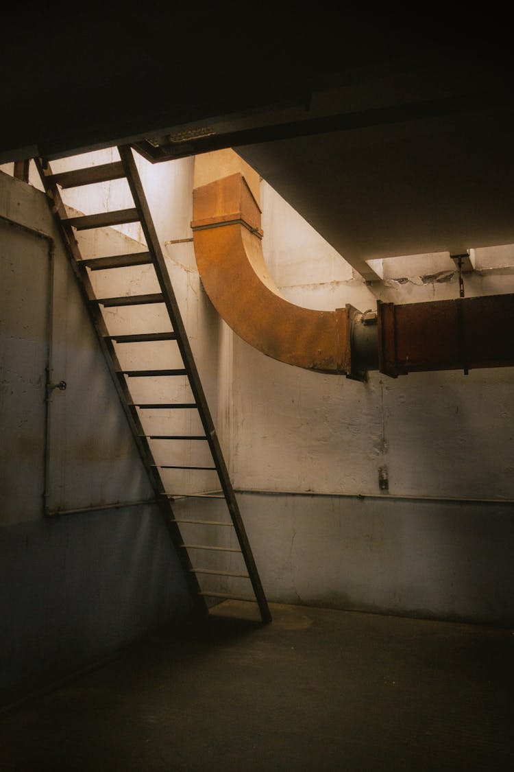 Pipe And Ladder In Empty Hall