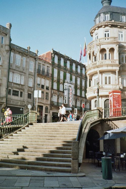 Free Vibrant cityscape of Porto, Portugal featuring historic architecture and bustling stairs. Stock Photo