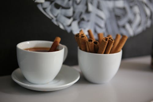 Free Chocolate Sticks on Two White Ceramic Cups Stock Photo