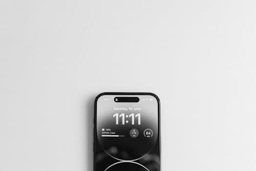 Free Time on iPhone Touchscreen Stock Photo