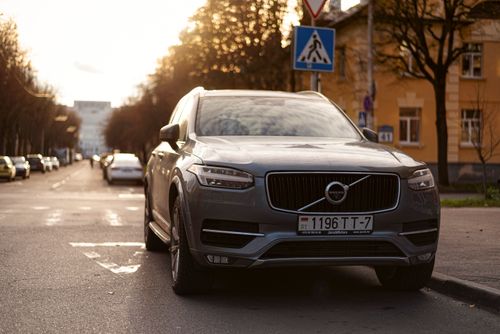 Free A Volvo XC90 parked on an urban street in Minsk during sunset with urban surroundings. Stock Photo