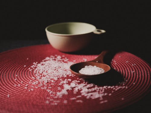 Free Brown Wooden Spoon With Grains on Red Table Cloth Stock Photo
