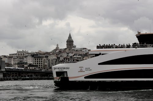 Ferry near Galata Bridge and Tower in Istanbul