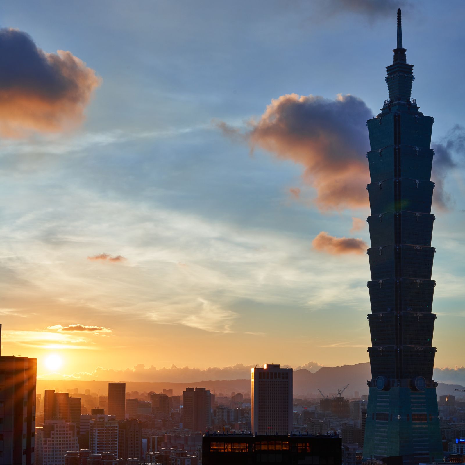 Taipei 101 rising over the Taipei skyline at sunset