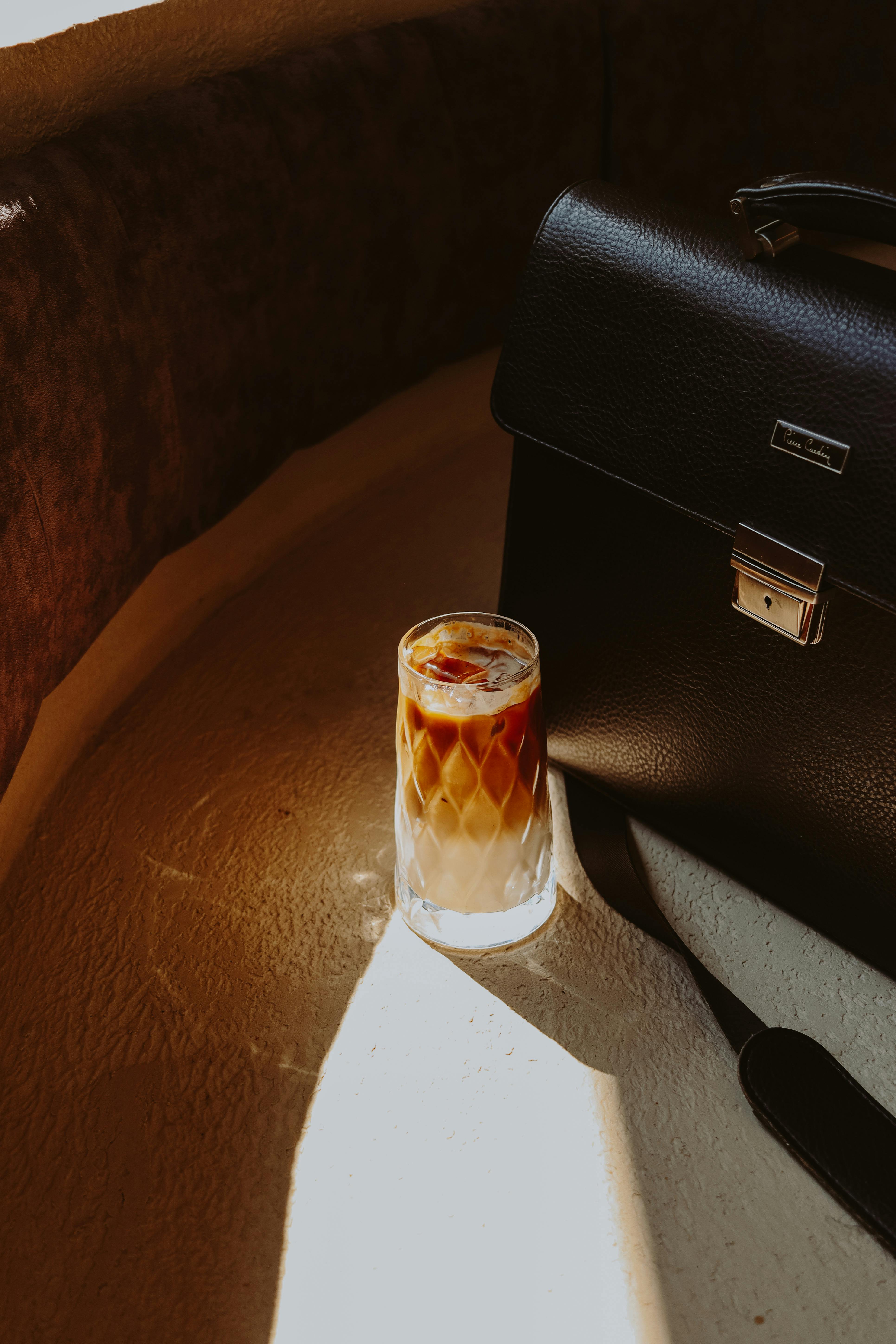 Briefcase and a Cold Drink · Free Stock Photo