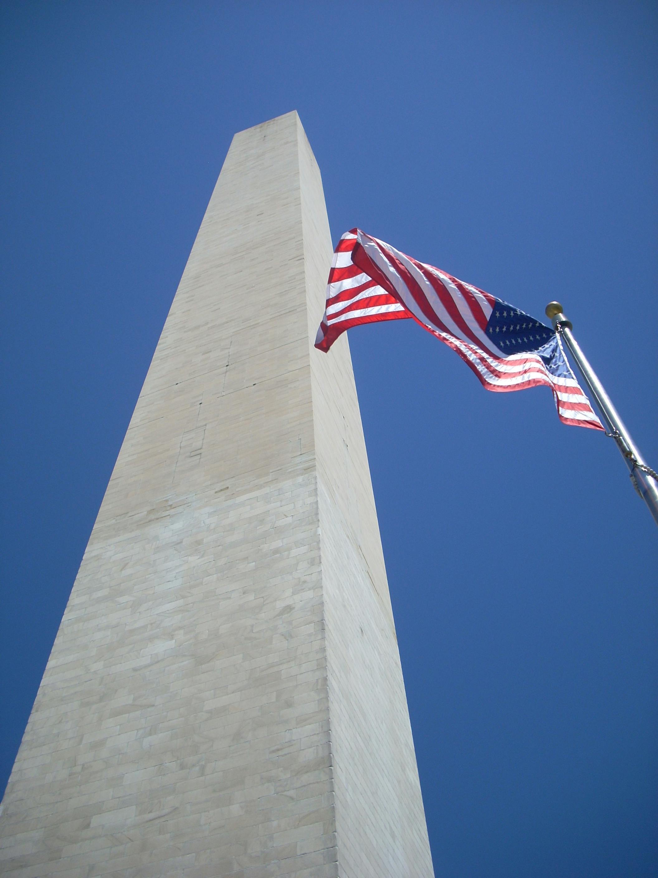 american flag near washington monument in usa