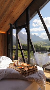Enjoy breakfast in a beautiful chalet overlooking the Italian Alps in Trentino-Alto Adige.