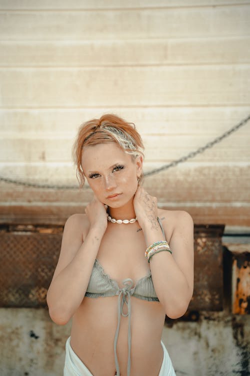 Woman in Bikini Holding Hands on Neck