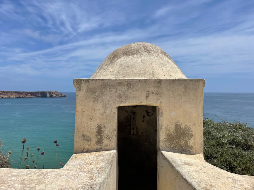 Old fortification with sea view under clear sky, capturing ancient architecture and serene coastline.