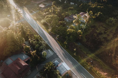 Aerial View of an Asphalt Road in a Tropical Village 