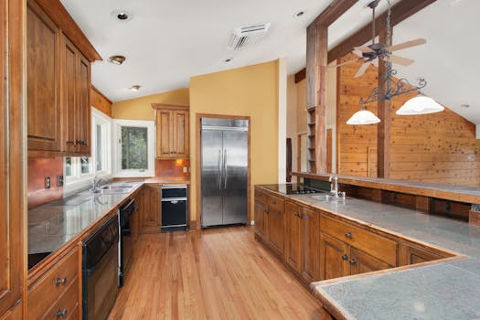 Spacious rustic kitchen featuring wooden cabinets and modern stainless steel appliances.