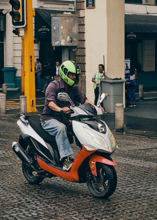 Driver Riding a Scooter