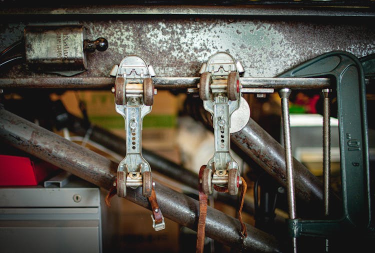 Vintage Roller Skates On Railing