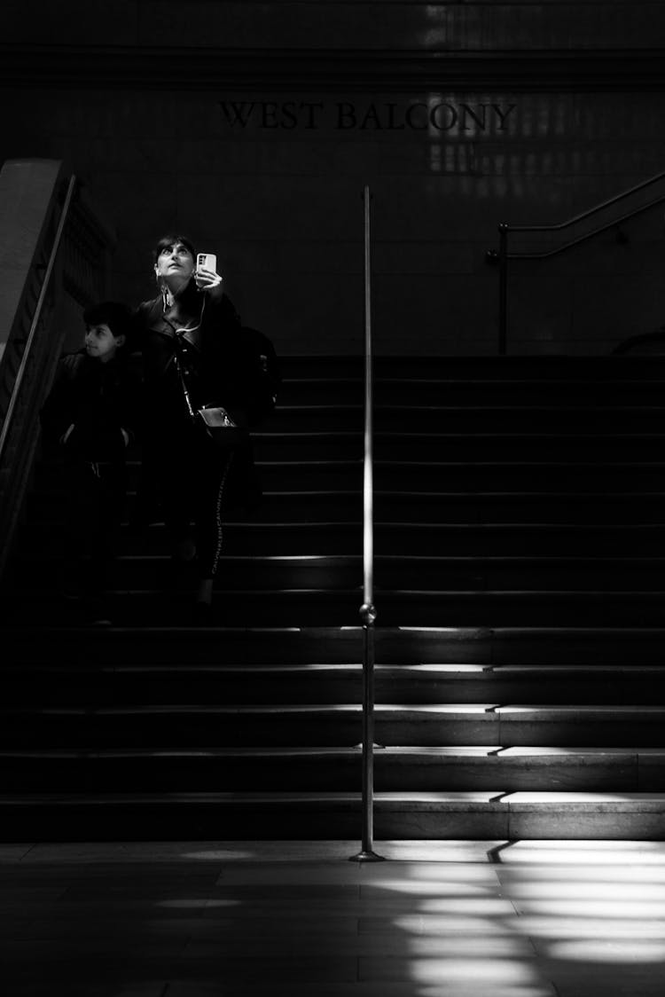 Woman Walking On Steps In Shadow