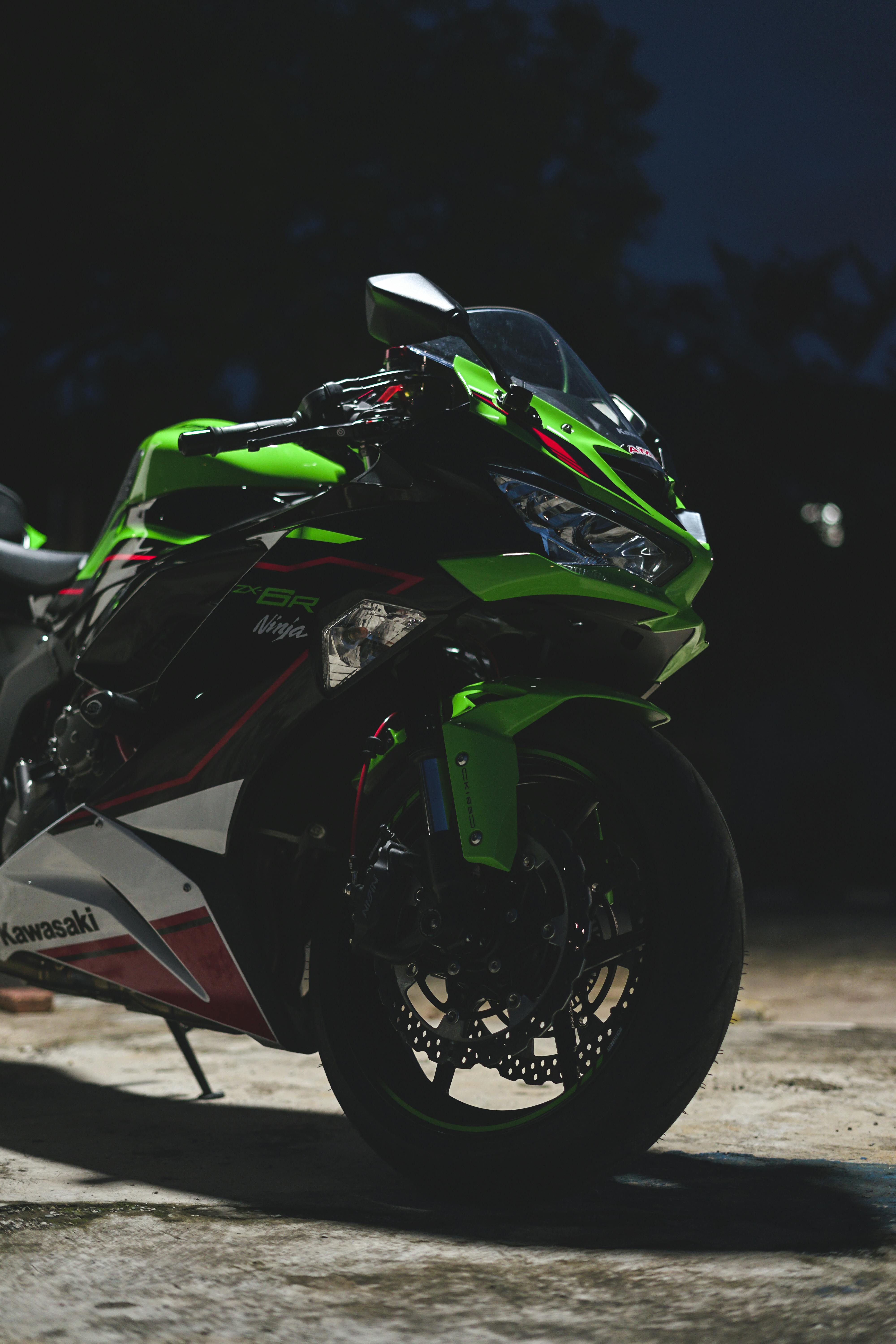 Download Thrilling Speed - Kawasaki Ninja Motorcycle On Road Wallpaper |  Wallpapers.com