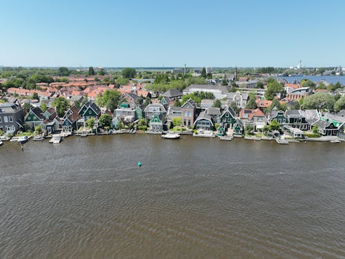 Aerial View of Houses with Piers on the Riverbank