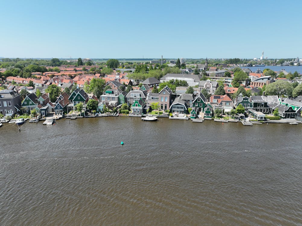 Aerial View of Houses with Piers on the Riverbank