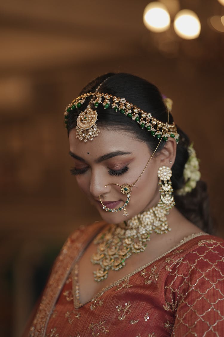 Woman With Golden Jewelry Around Face