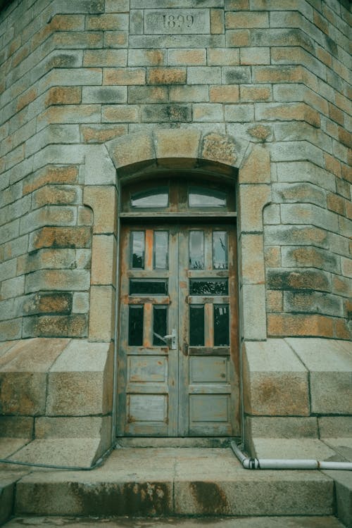 Old Wooden Door in a Brick Building 