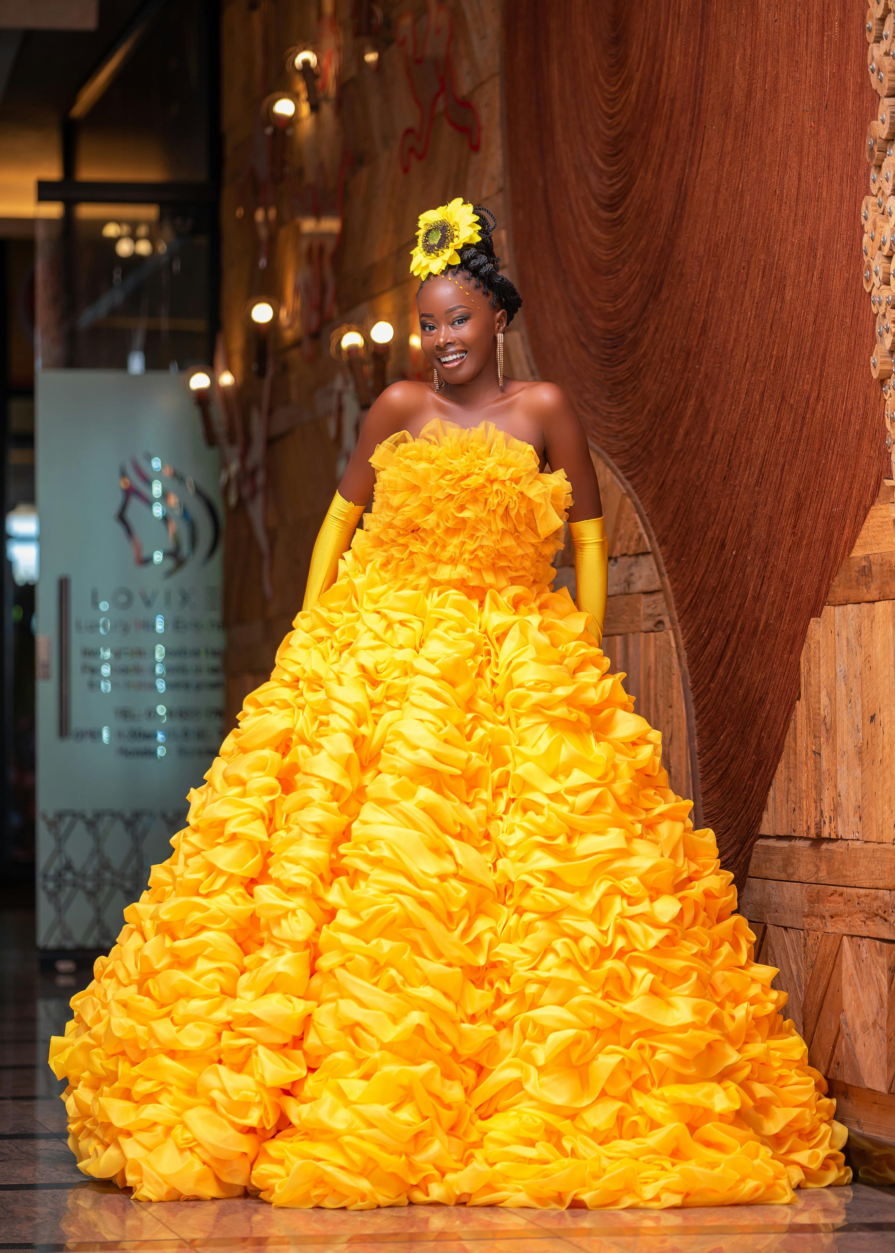 Smiling Woman in a Yellow Ball Gown Free Stock Photo