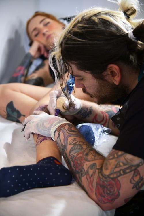 Woman Getting a Tattoo