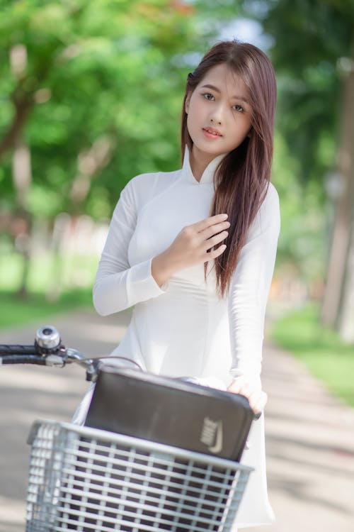 Brunette by Bicycle in Park