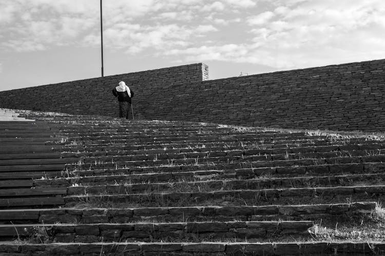 Woman Climbing Up The Steps