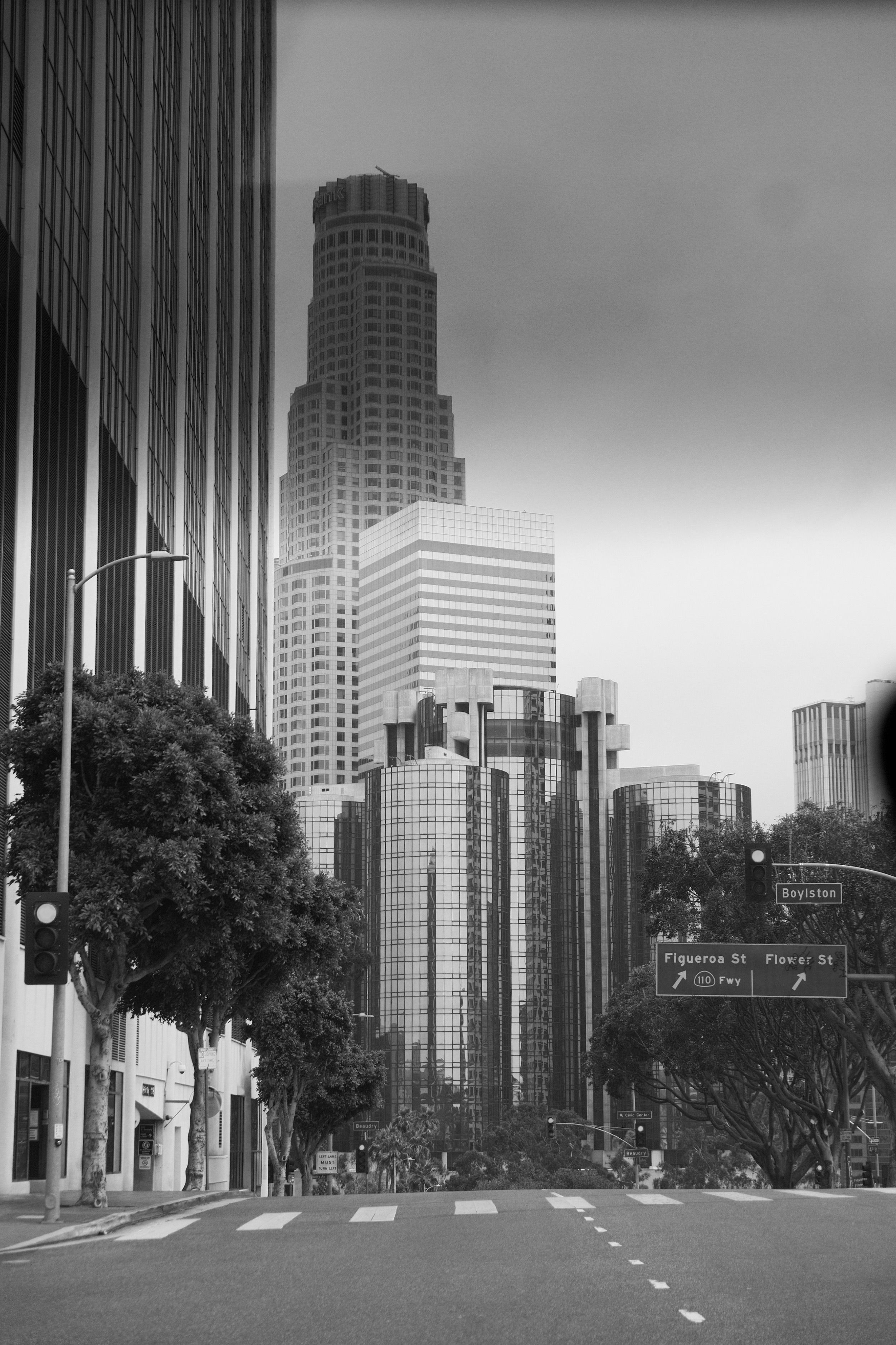 Iconic b&w skyline of Los Angeles featuring skyscrapers and city streets.