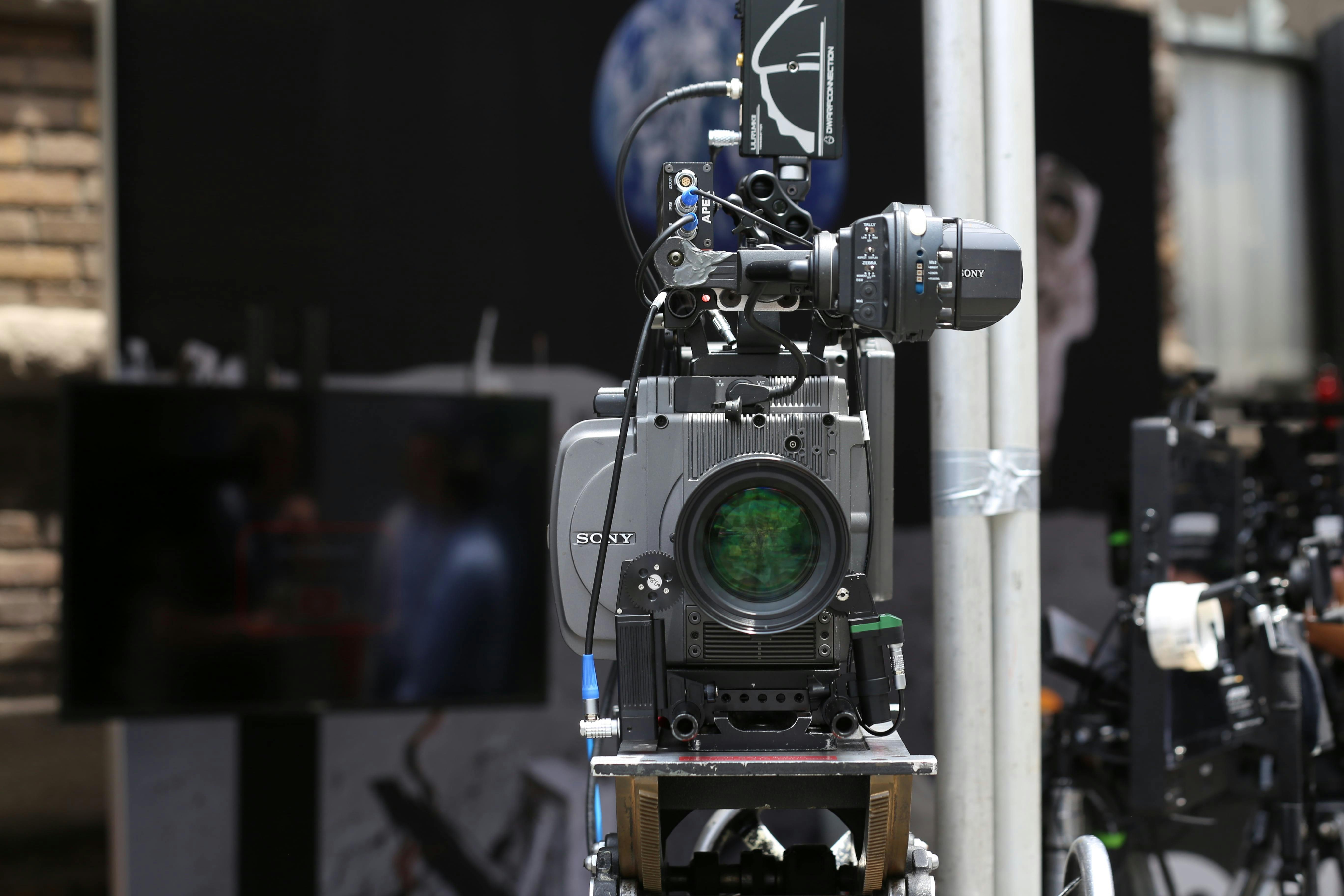 Close-up of a high-tech video camera setup for professional filming.