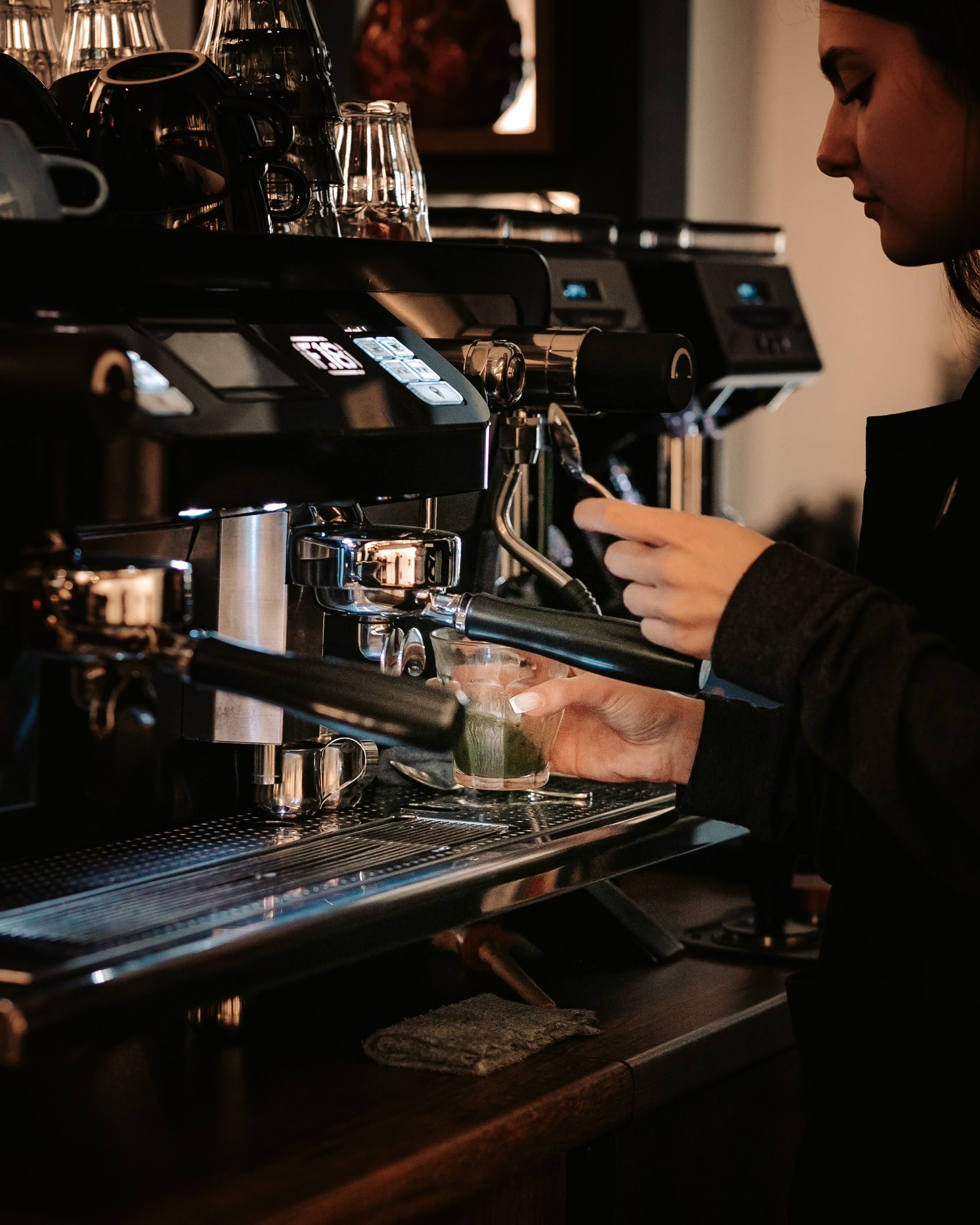 Woman by Coffee Machine · Free Stock Photo
