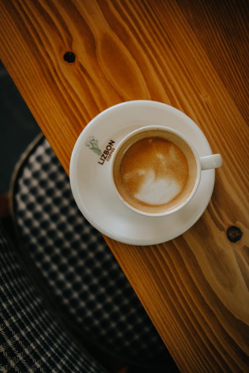 Free Top View of a Cup of Coffee Standing on a Table  Stock Photo