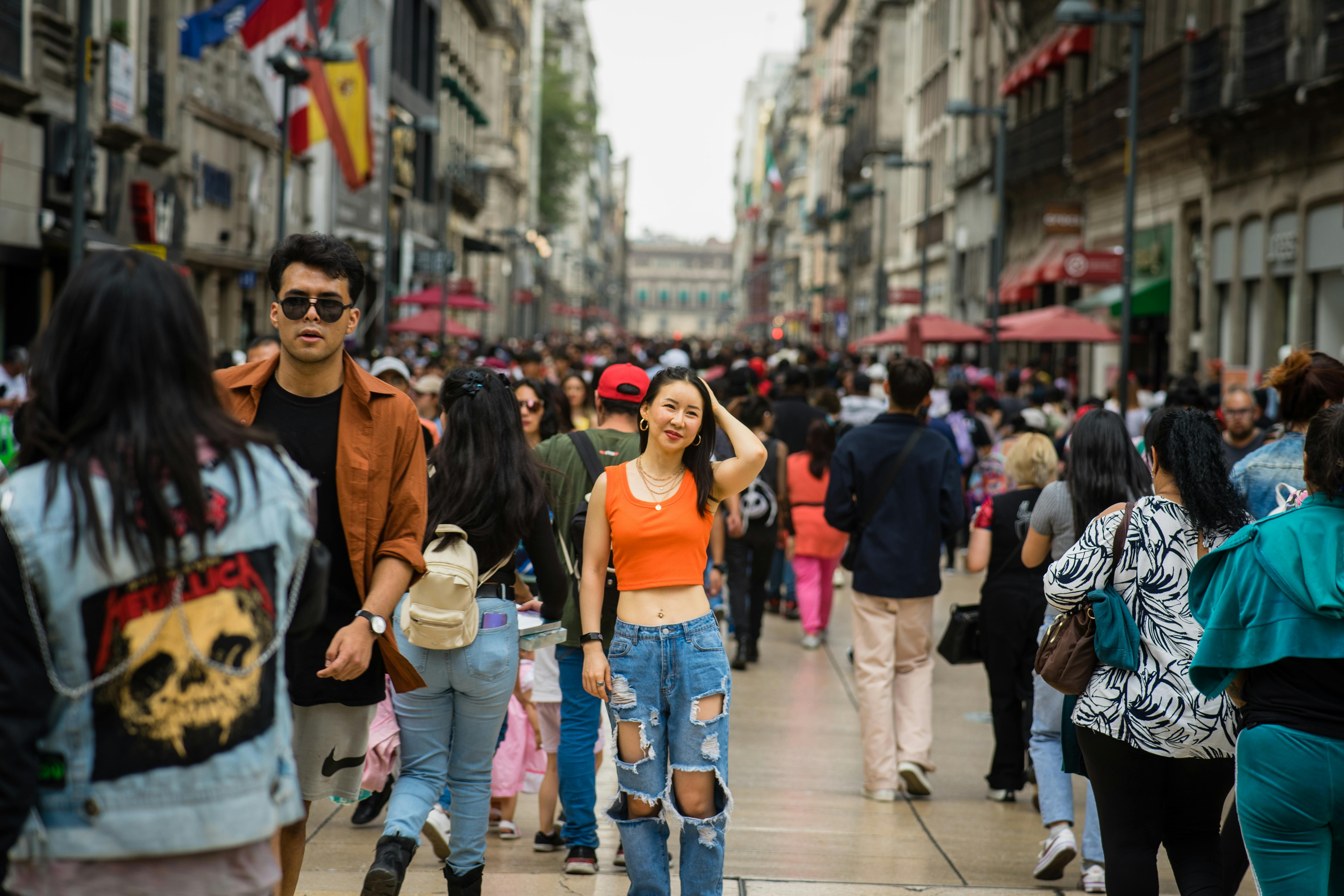 happy young asian woman visiting the streets of mexico city