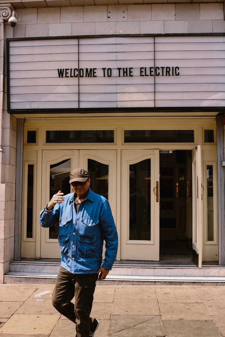 Photo Of A Man In Front Of An Open Gate