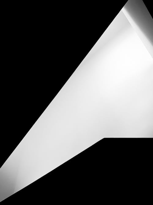 White Triangle Shape against Black Background