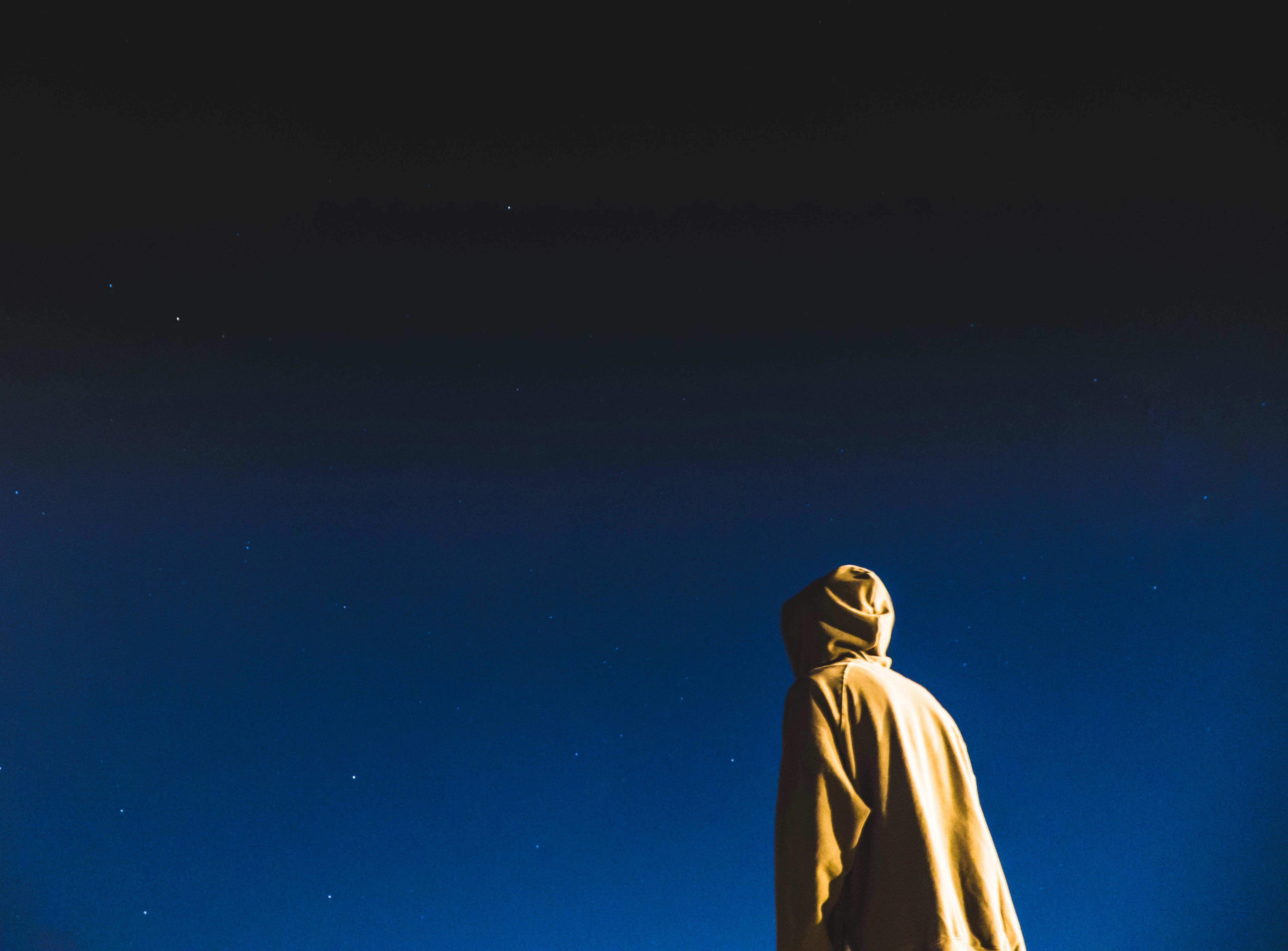 Person Standing Under Dark Sky Free Stock Photo