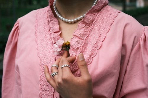 Woman with a Flower behind her Blouse