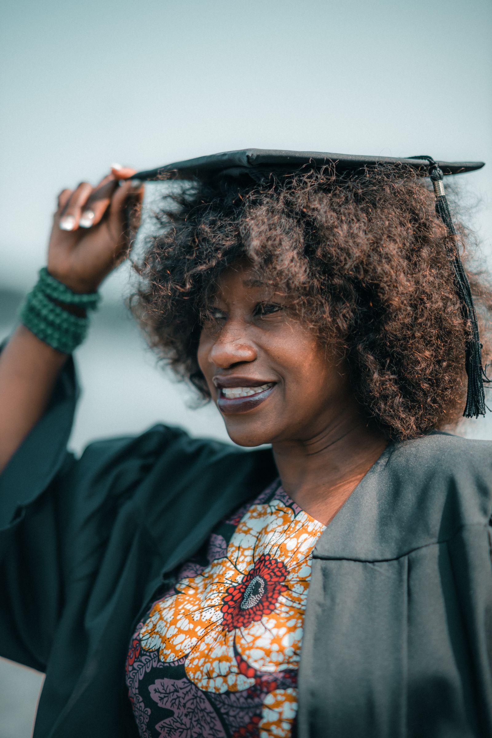 Smiling graduate in cap and gown
