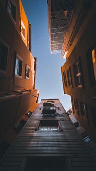 View from a narrow urban alley in Türkiye showcasing towering buildings.