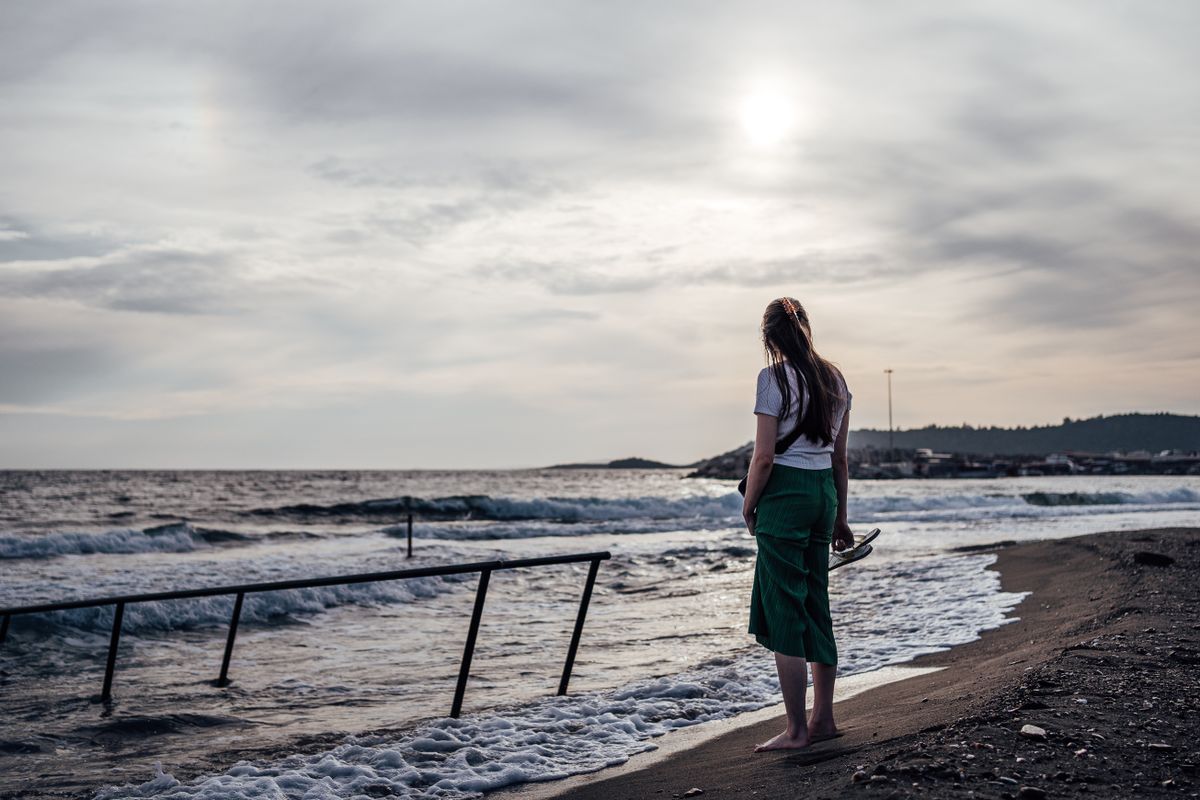 Woman Walking Barefoot on Beach at Sunset · Free Stock Photo